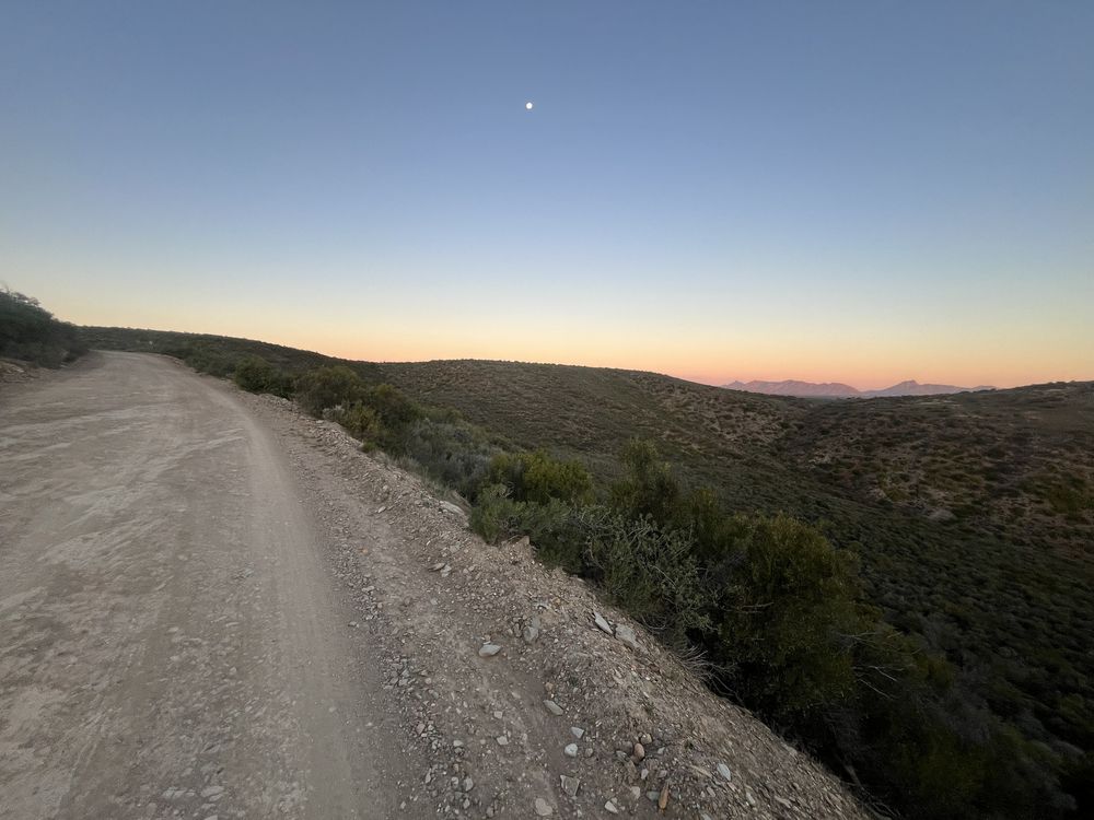 Gravel motorcycle touring road at dusk in the mountains of South Africa
